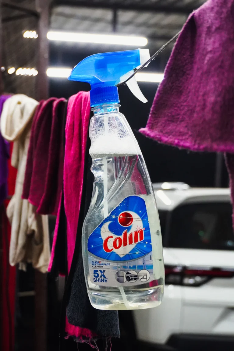 Cleaning spray bottle and cloths ready for a quick home cleaning routine