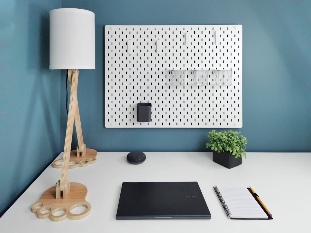 Organized home office desk with pegboard storage