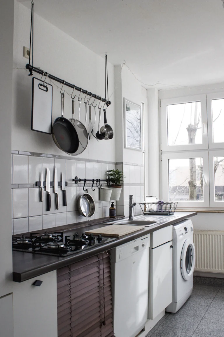 Small kitchen with compact cabinets and open shelving