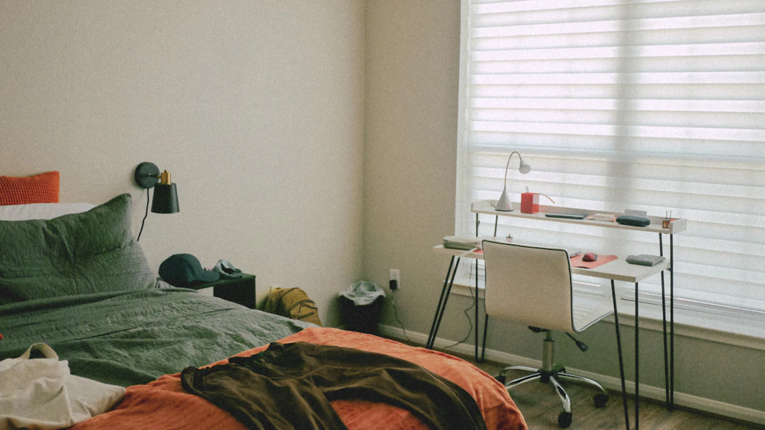 Compact desk and chair arranged in a bedroom corner