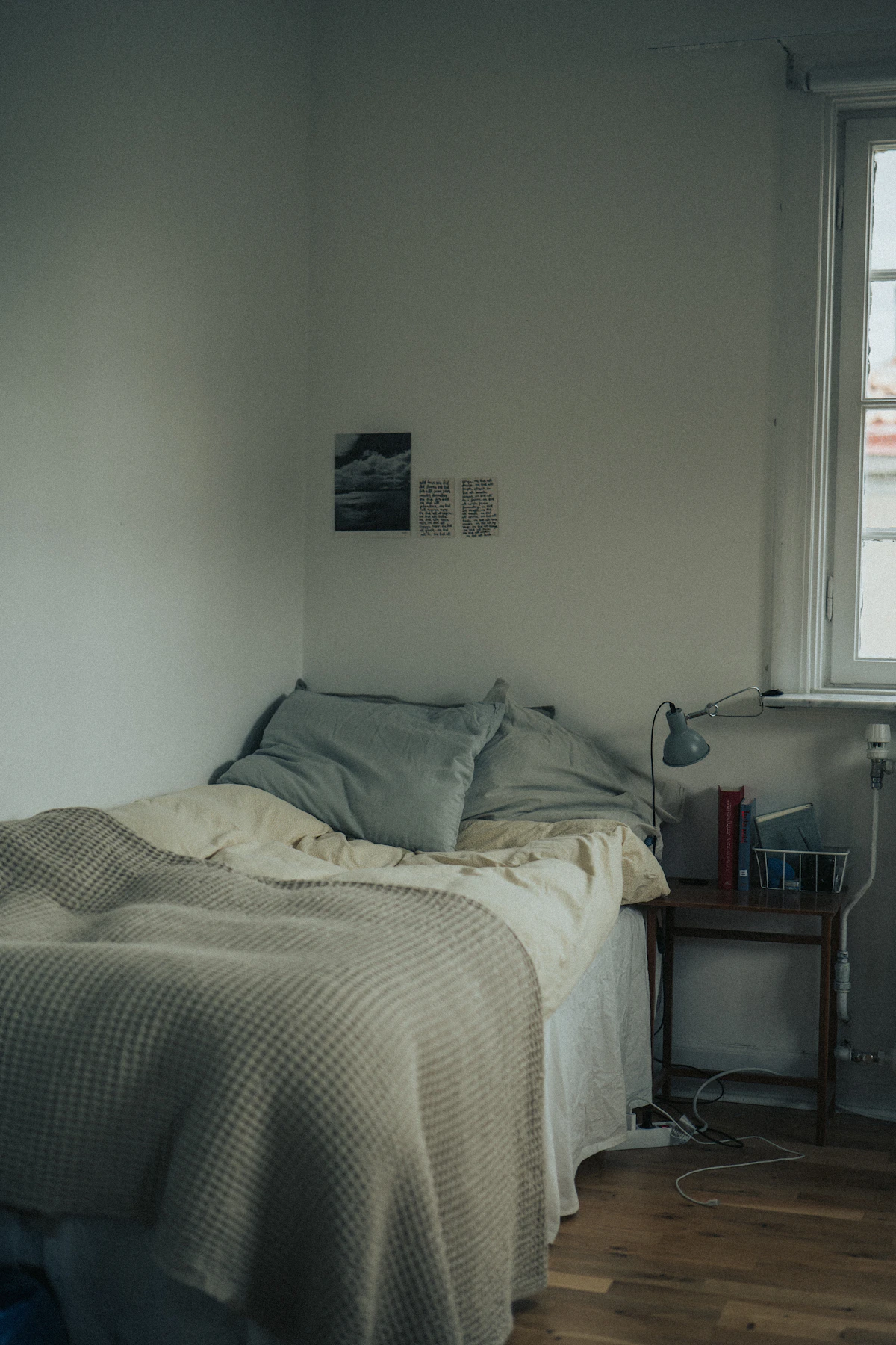 Simple small bedroom with a clear bed and open floor beside it