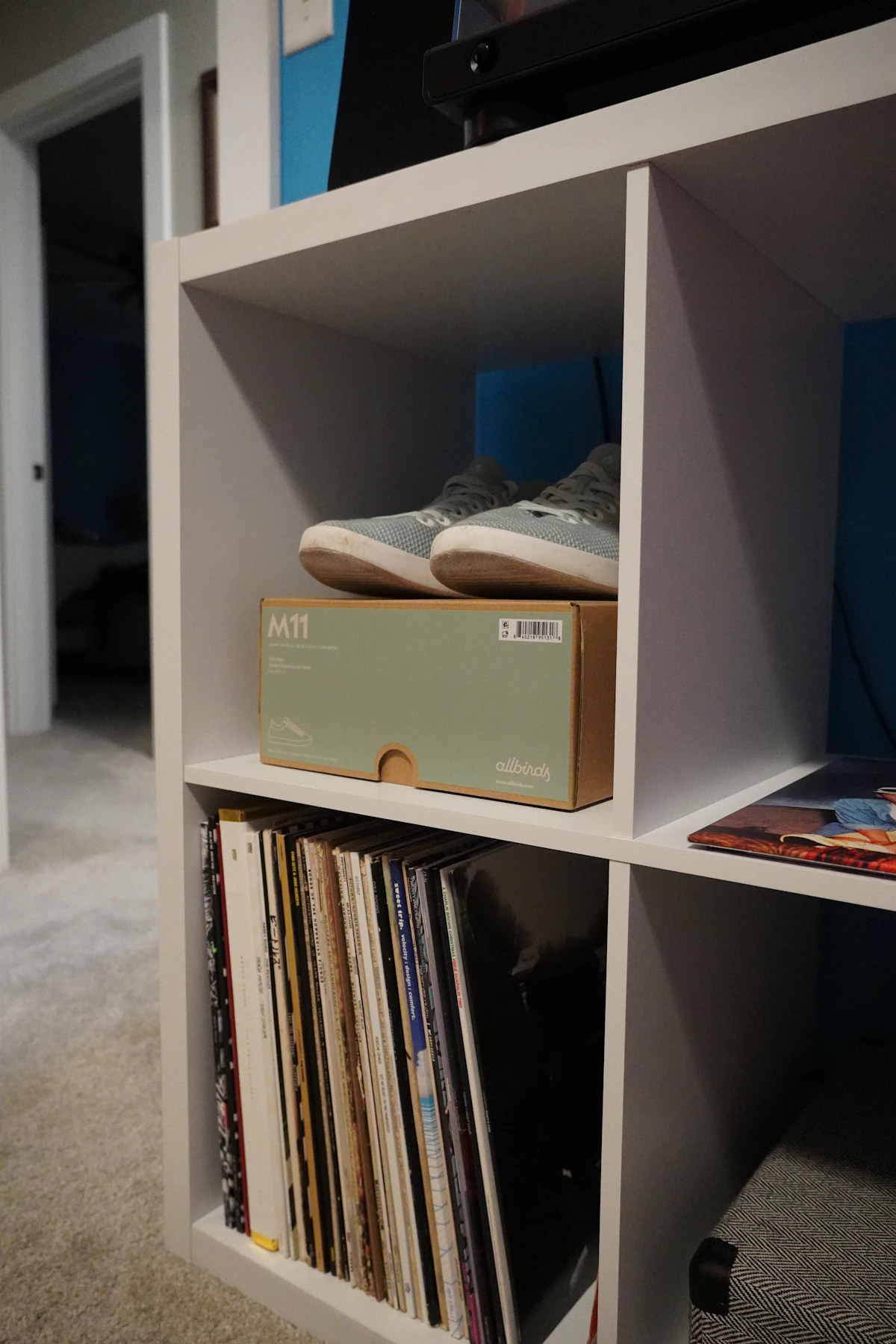Small cube bookcase with open compartments and storage boxes